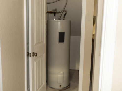 Water heater in a storage closet